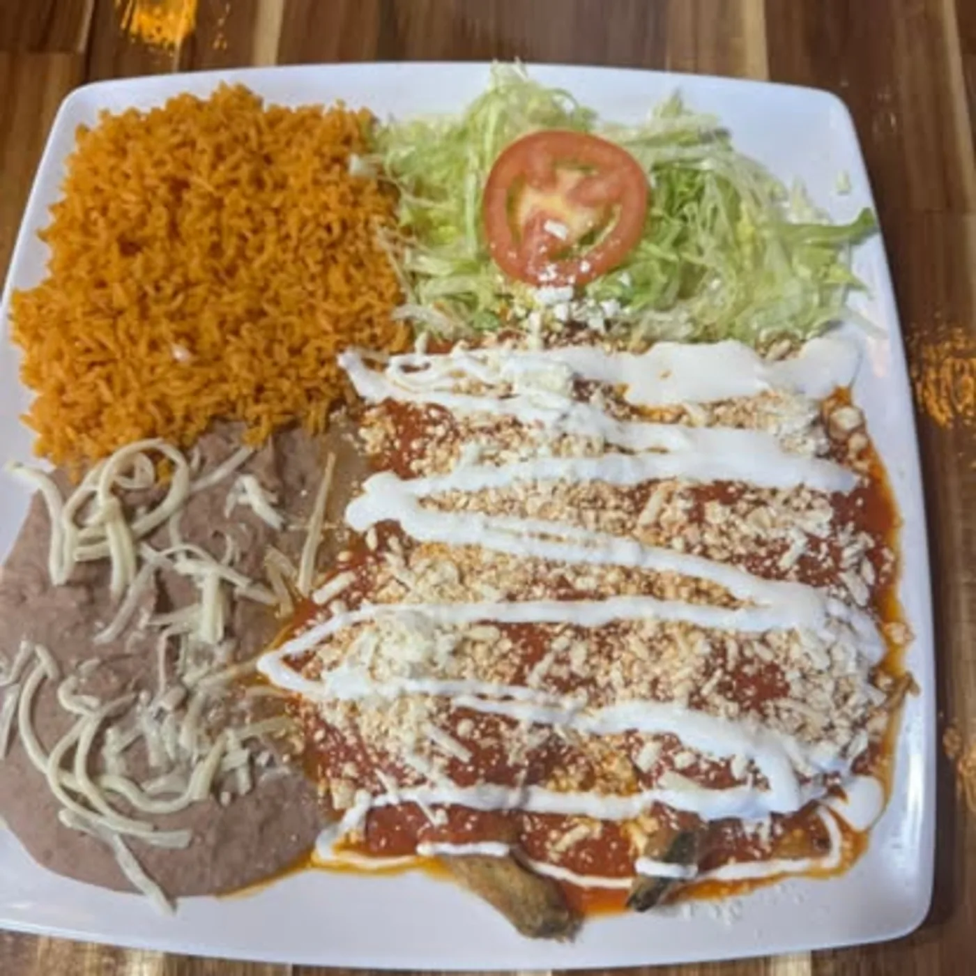 Chile relleno dinner plate with rice and beans from Nina's Tacos near DeKalb