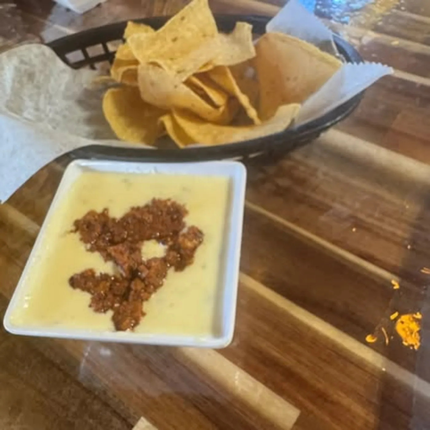 Warm queso dip with chips at Nina's Tacos